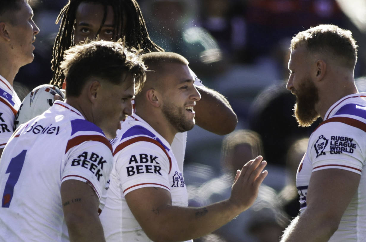 Lewis back playing with a smile on his face